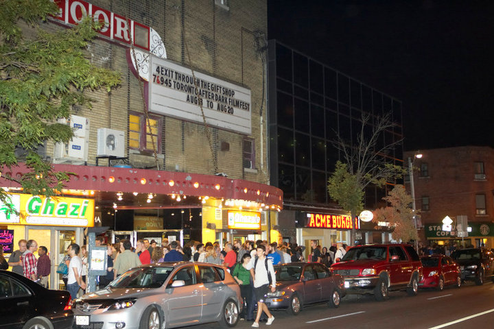 nighttime crowd gathered outside a hole-in-the-wall bloor cinema with toronto after dark on the marquee